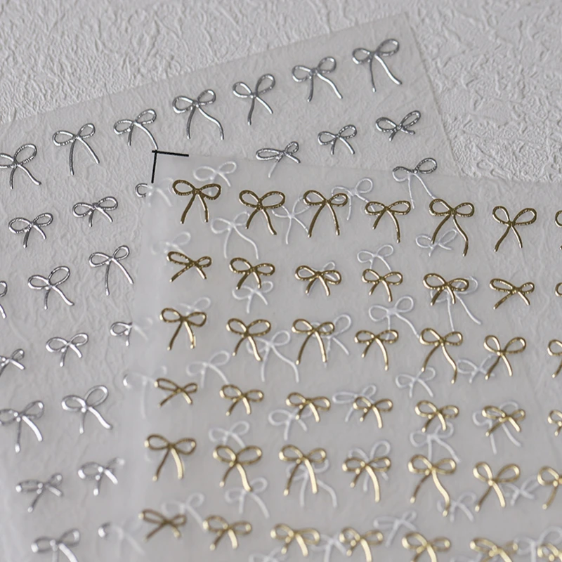 사랑스러운 골드 실버 블랙 화이트 라인 Bowknot 3D 자기 접착제 네일 아트 장식 스티커 리본 귀여운 매니큐어 데칼 도매 title=사랑스러운 골드 실버 블랙 화이트 라인 Bowknot 3D 자기 접착제 네일 아트 장식 스티커 리본 귀여운 매니큐어 데칼 도매 